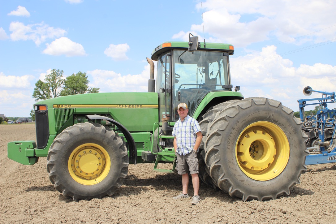 Adam with John Deere tractor